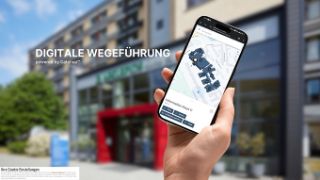 Das Bild zeigt ein Smartphone mit einem Lageplan der Asklepios Klinik St. Georg.
