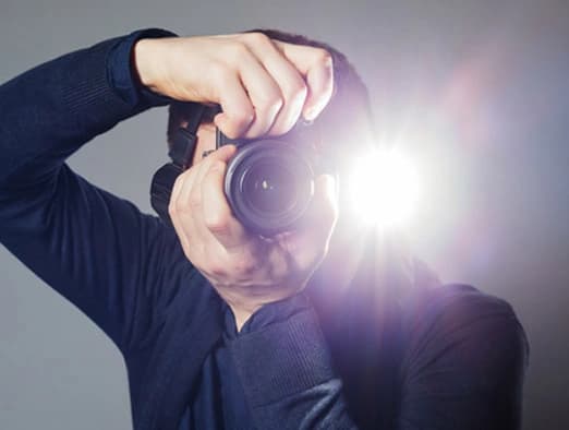Bild: Fotograf mit Kamera